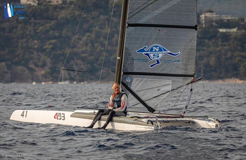 A-Cat Worlds at Toulon, France Day 2 - Gustavo Doreste ESP 72 rests after his first Classic Worlds bullet photo copyright Gordon Upton / www.guppypix.com taken at Yacht Club de Toulon and featuring the A Class Catamaran class