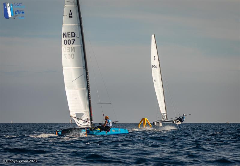 A-Cat Worlds at Toulon, France Day 4 - Kuba Surowiec POL 41 show a clean pair of heels to Mischa Heemskerk NED 7 in the Open fleet battle. Both went into the race on equal points - photo © Gordon Upton / www.guppypix.com