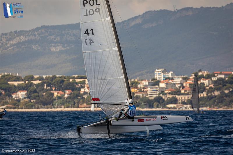 A-Cat Worlds at Toulon, France Day 5 - Kuba Surowiec POL 41 fighting to increase his slim Championship lead photo copyright Gordon Upton / www.guppypix.com taken at Yacht Club de Toulon and featuring the A Class Catamaran class