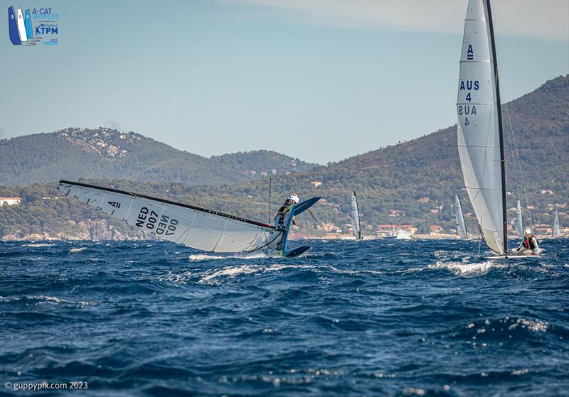 A-Cat Worlds at Toulon, France Day 6 - Maybe the moment Mischa Heemskerk NED loses the Championship?  This bottom mark capsize allowed Kuba Surowiec POL to catch up following his similar incident at the top of the course photo copyright Gordon Upton / www.guppypix.com taken at Yacht Club de Toulon and featuring the A Class Catamaran class