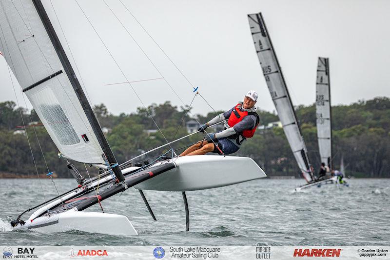 Australian A-Cat Nationals on Lake Macquarie Day 1 - Dave McKenszie shows the Classic category’s curved foils photo copyright Gordon Upton taken at South Lake Macquarie Amateur Sailing Club and featuring the A Class Catamaran class