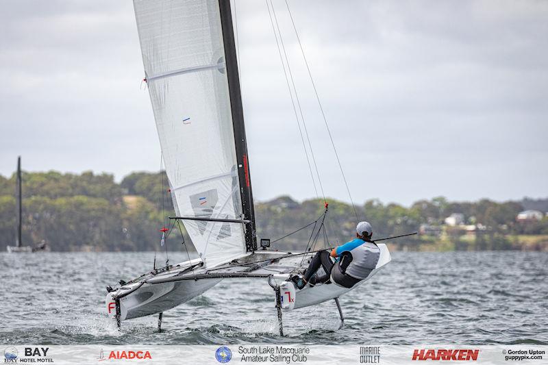 Australian A-Cat Nationals on Lake Macquarie Day 2 - Matt Holman gets airborne in 13 knots of boatspeed - photo © Gordon Upton