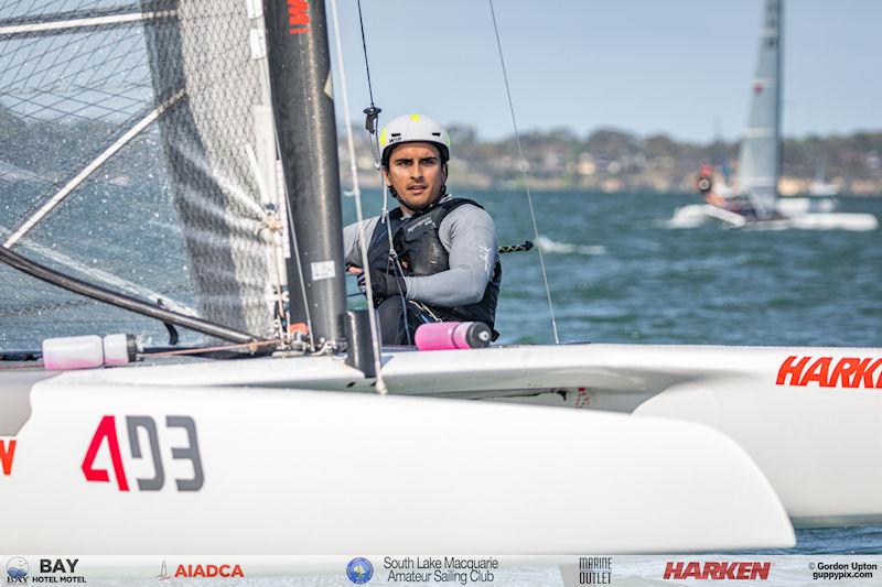 Australian A-Cat Nationals on Lake Macquarie Day 3 - 2022 World Open Champ, Ravi Parent, is one of the US guest sailors, and chasing Adam Beattie for the line photo copyright Gordon Upton / www.guppypix.com taken at South Lake Macquarie Amateur Sailing Club and featuring the A Class Catamaran class