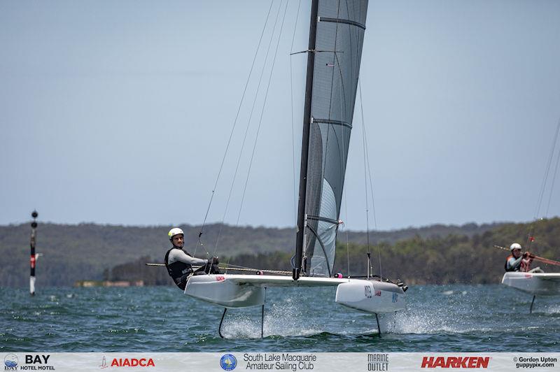 Australian A-Cat Nationals on Lake Macquarie Day 4 - Top US Sailor Ravi Parent, closes in on the bottom gate, chased down by Adam Beattie in the first race photo copyright Gordon Upton / www.guppypix.com taken at South Lake Macquarie Amateur Sailing Club and featuring the A Class Catamaran class