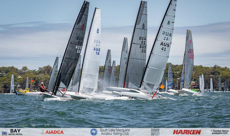 Australian A-Cat Nationals on Lake Macquarie Day 4 - The crowd-pleasing melee causing the Open fleet second race general recall photo copyright Gordon Upton / www.guppypix.com taken at South Lake Macquarie Amateur Sailing Club and featuring the A Class Catamaran class
