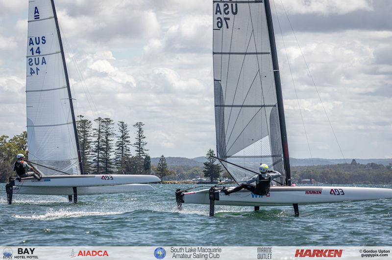 Australian A-Cat Nationals on Lake Macquarie Day 4 - Adam Beattie, AUS 14, and Ravi Parent, USA 76, race for the line at 31 kts photo copyright Gordon Upton / www.guppypix.com taken at South Lake Macquarie Amateur Sailing Club and featuring the A Class Catamaran class