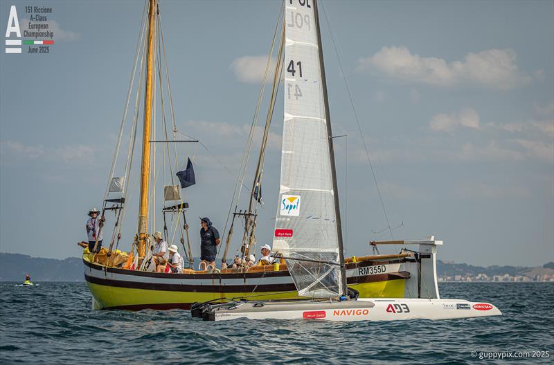 Many sailors don't like to sail through the finish for superstitious reasons - A-Class Cat European Championships at Riccione - Practice Race photo copyright Gordon Upton / www.guppypix.com taken at 151 Riccione  and featuring the A Class Catamaran class