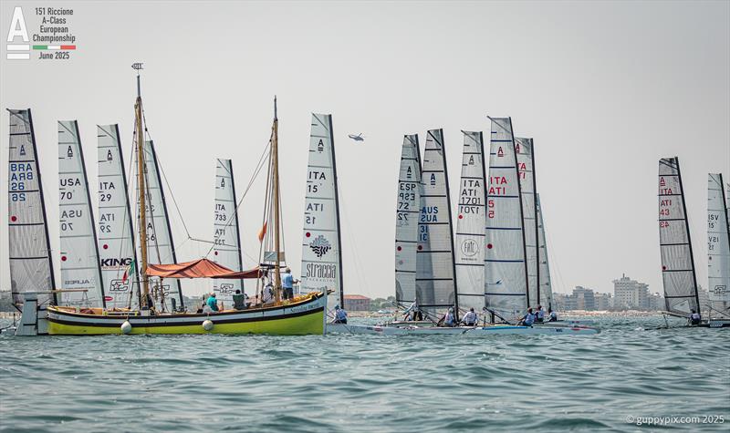 Classic fleet Race 6 unser starters orders. The the old 1928 lugger Saviolina serves as a committee boat with character - A-Class Cat European Championships at Riccione Day 4 - photo © Gordon Upton / www.guppypix.com