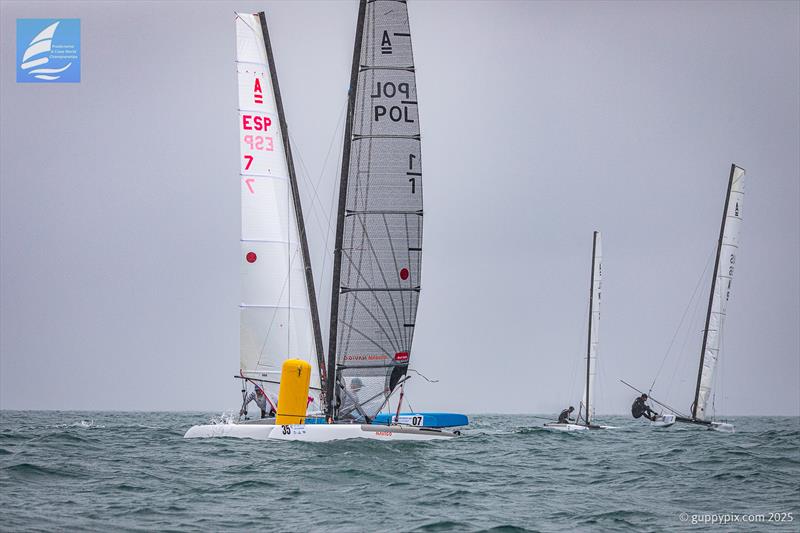 PredictWind A-Class Cat Worlds 2025 Day 3 - The winning move. Jacek Noetzel snatches the lead from Micky Todd at the bottom mark in the first race - photo © Gordon Upton / www.guppypix.com