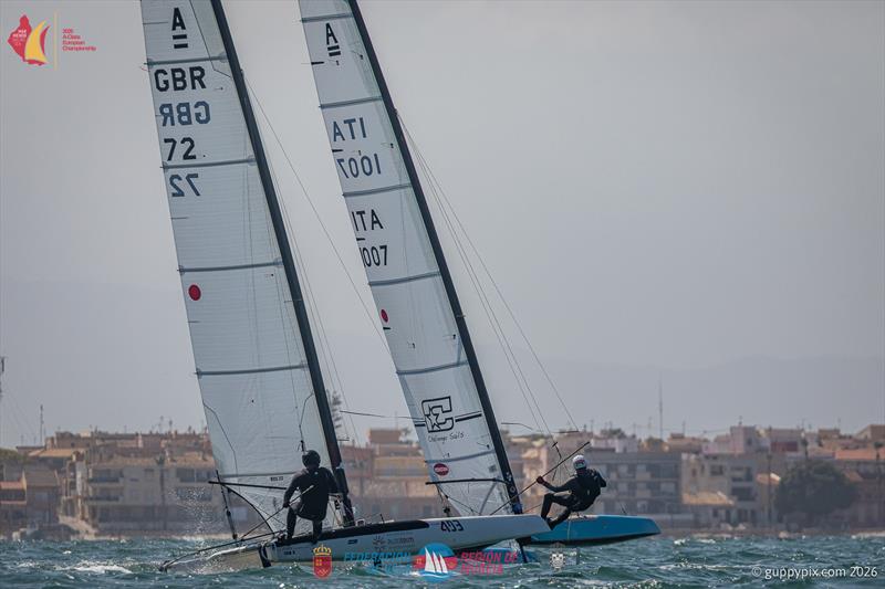 A Class Catamaran Europeans Day 3 - GBR sailor Owen Cox tries to keep up with Italian Classic Champ Alessandro Rosi photo copyright Gordon Upton / www.guppypix.com taken at  and featuring the A Class Catamaran class