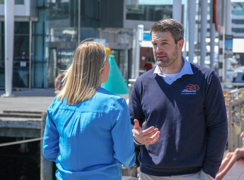 DutchSail's Simeon Tienpont talks with 1News' Abby Wilson - with the Emirates Team NZ base in the background - photo © Richard Gladwell