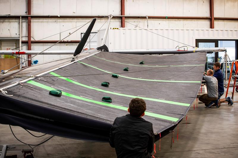 Checking the doungle-skinned mainsail - American Magic - photo © Amory Ross