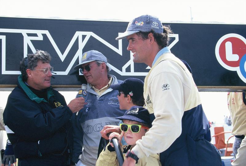 Three generations of the Coutts family aboard NZL32 - with Russell Coutts' late father, Alan, leaning against the boom and being interviewed by PJ Montgomery - America's Cup, San Diego, May 1995 photo copyright Sally Simmins taken at Royal New Zealand Yacht Squadron and featuring the ACC class