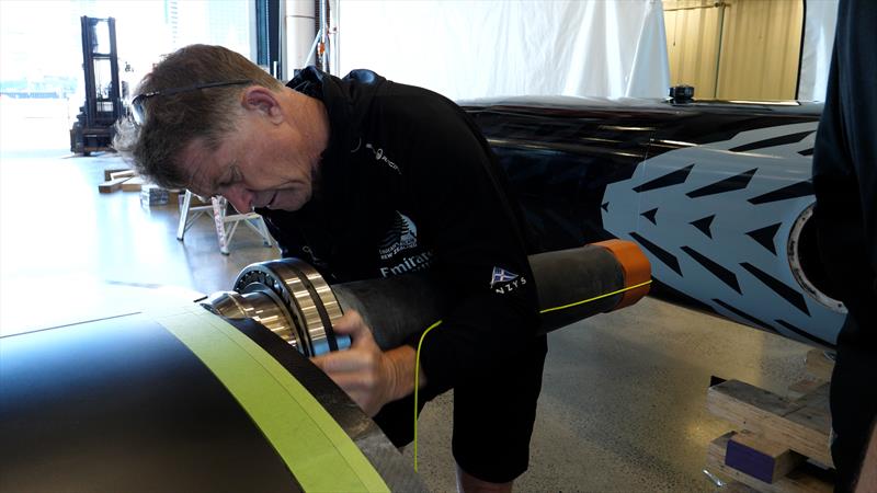 Sean Regan fits the wingsail bearings - Emirates Team New Zealand's land yacht is assembled ahead of the speed trial testing in Auckland - may 2022 photo copyright Emirates Team New Zealand taken at Royal New Zealand Yacht Squadron and featuring the ACC class