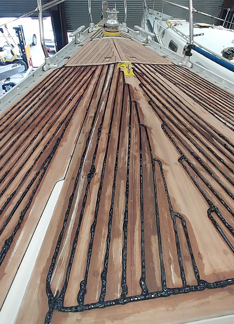 Caulking being replaced on a section of teak deck - photo © Ancasta Group