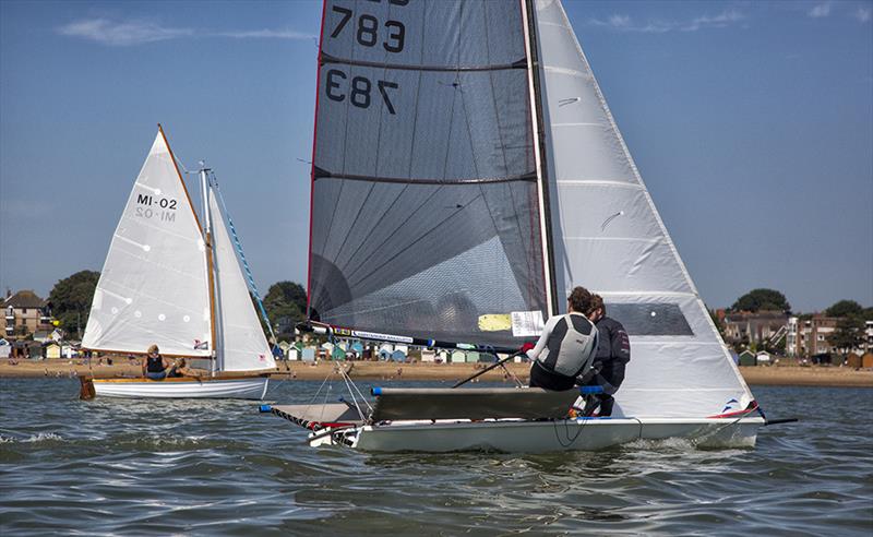 A B14 with a Mersea Fisherma's Open Boat and beach huts beyond during Mersea Week and Mersea Town Regatta 2016 - photo © Chrissie Westgate