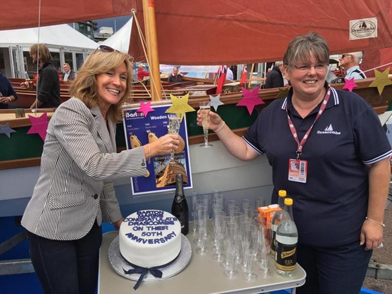 Barton Marine's Suzanne Blaustone toasts the Drascombe Lugger 50th Anniversary - photo © Barton Marine