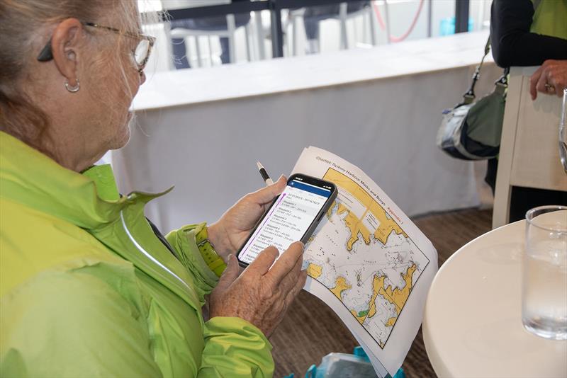 Polished outfit – Holy Cow ensuring they have the low down on both the course and the weather! photo copyright John Curnow taken at Cruising Yacht Club of Australia and featuring the Beneteau class