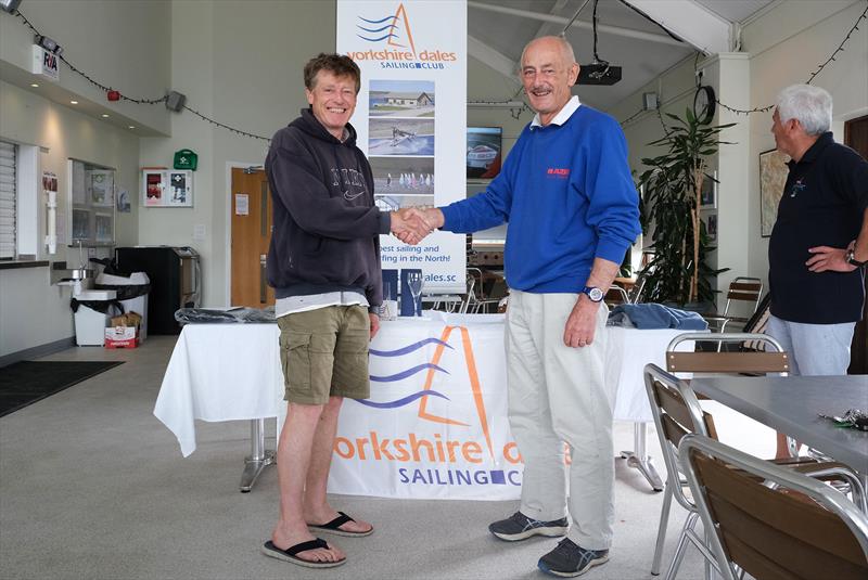 Winner Ian Smith being congratulated by Club Secretary and Blaze sailor, Tim Heaton in the Blaze open meeting at Yorkshire Dales photo copyright Paul Hargreaves taken at Yorkshire Dales Sailing Club and featuring the Blaze class