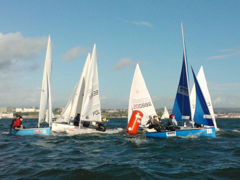James Rosser & Philippa Mitchell (Birmingham) and Liam Arrowsmith & Richard Long (Plymouth), with Filip Kobielski (Aston) in the Laser at the UK Student Fleet Champs photo copyright Alex King taken at Mount Batten Centre for Watersports and featuring the BUSA class