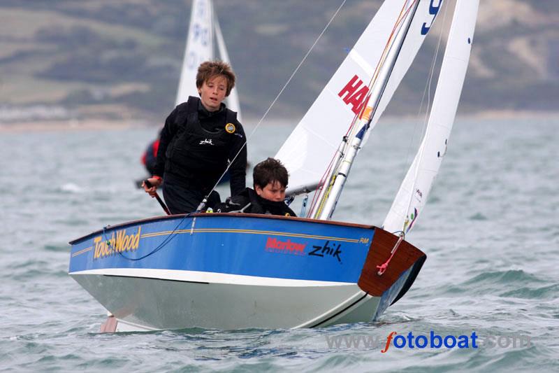 Cadet Class World Championships day 3 photo copyright Mike Rice / www.fotoboat.com taken at Weymouth & Portland Sailing Academy and featuring the Cadet class