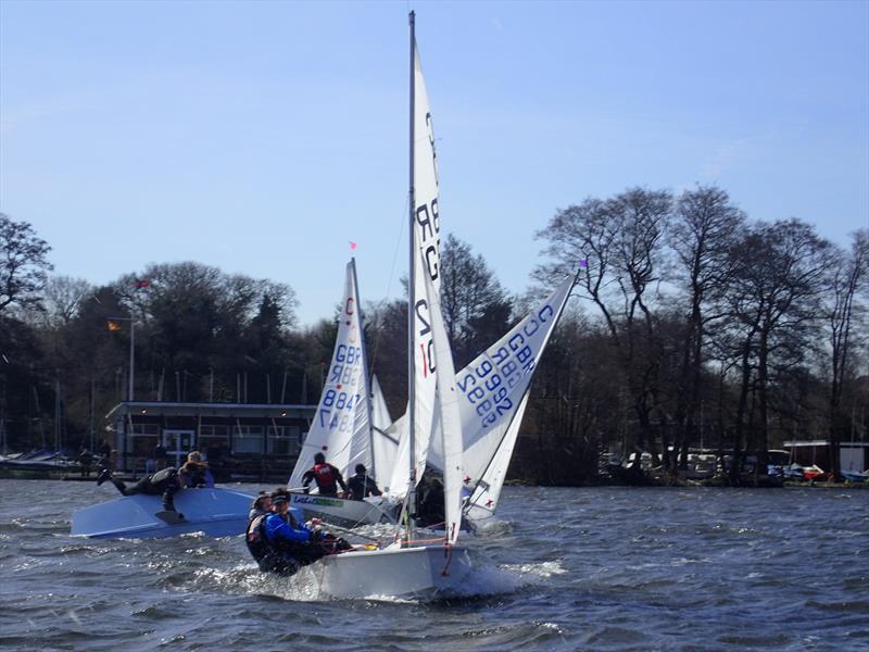 Fun and games at the first leeward mark during the Frensham Cadet Open photo copyright Steph Videlo taken at Frensham Pond Sailing Club and featuring the Cadet class