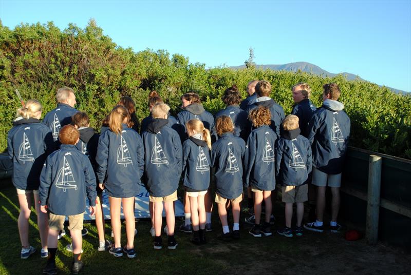 The Cadet sailors, coach Tony Bull and Team Manager Sam Ibbott show off their Australian team jackets photo copyright Peter Campbell taken at Sandy Bay Sailing Club and featuring the Cadet class