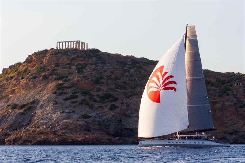 Adrian Keller's Allegra crosses the finish line of the 2022 Aegean 600 beneath the Temple of Poseidon on Cape Sounion photo copyright Nikos Alevromytis / HORC AEGEAN 600 taken at  and featuring the Catamaran class