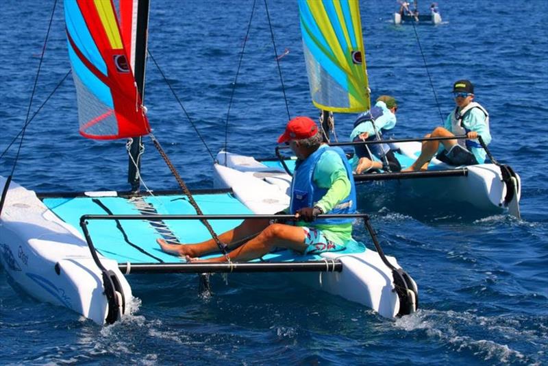 (l-r) Tony Sanpere single-handed and Finn Hodgins and Will Zimmerman double-handed in Hobie Wave Class on day 2 of the 50th St. Thomas International Regatta photo copyright Ingrid Abery taken at St. Thomas Yacht Club and featuring the Catamaran class