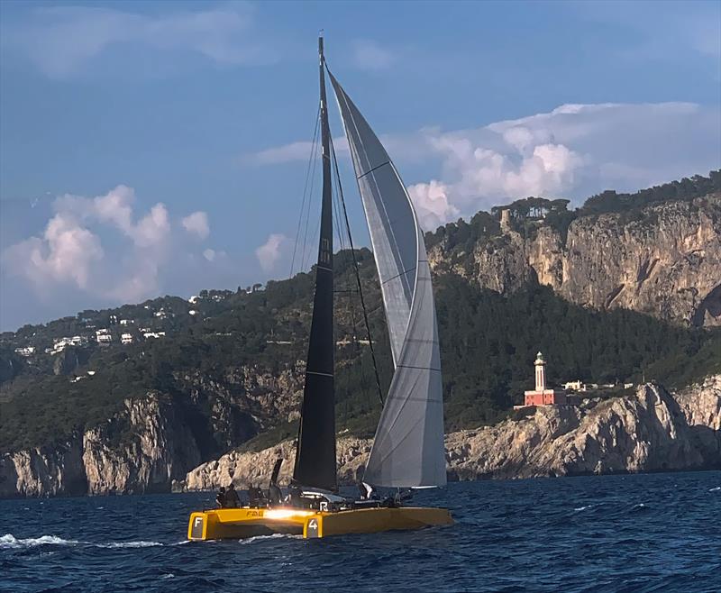 RAN 630 - The DNA F4 cat Falcon approaching the island of Capri photo copyright RAN 630 taken at Yacht Club Livorno and featuring the Catamaran class