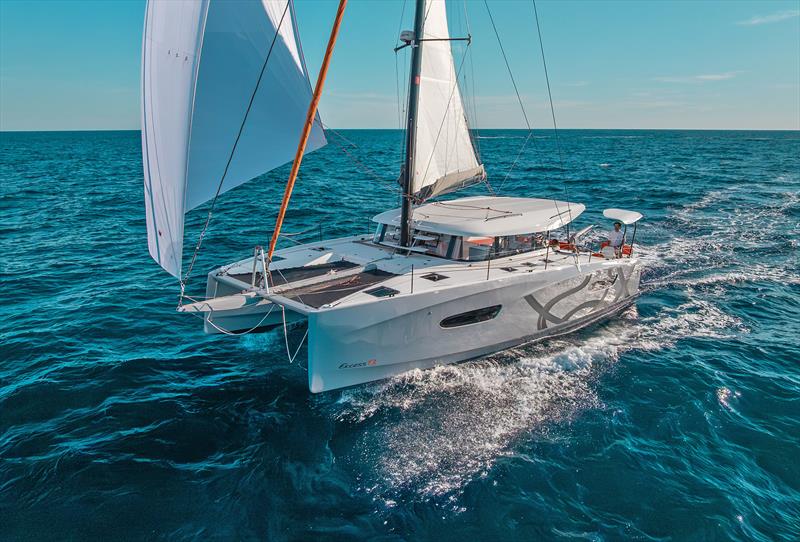 Crack on - Excess 13 with Pulse Line black stick, stanchions, and note the fixed bimini - photo © Yann Riou