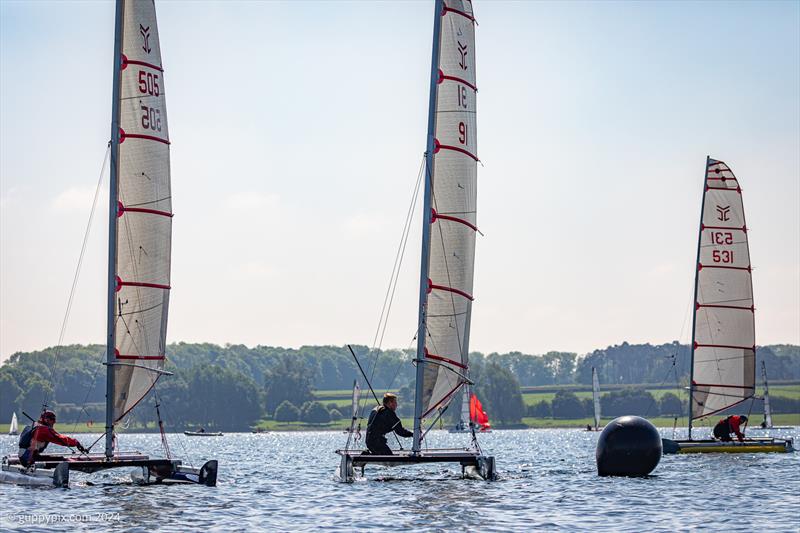 A trio of Catapults, Eamon Cotter 505, Gareth Ede 91 and Stuart Ede 531 reach the top mark in Sunday race one during the Rutland Cat Open 2024 photo copyright Gordon Upton / www.guppypix.com taken at Rutland Sailing Club and featuring the Catapult class