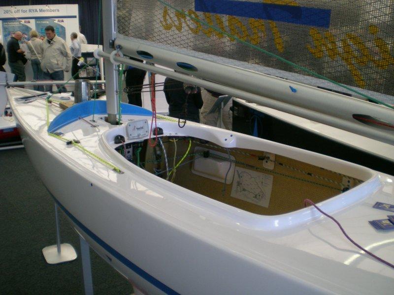 The helm sits inside a 2.4m yacht, with just their head poking out. They can steer with foot pedals or a central hand lever, and have all the ropes to hand photo copyright Magnus Smith / www.yachtsandyachting.com taken at RYA Dinghy Show and featuring the 2.4m class