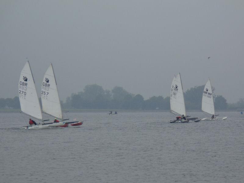 Alex Hovden leading the fleet down the first reach in the Challenger open meeting at Oxford photo copyright Marion Edwards taken at Oxford Sailing Club and featuring the Challenger class
