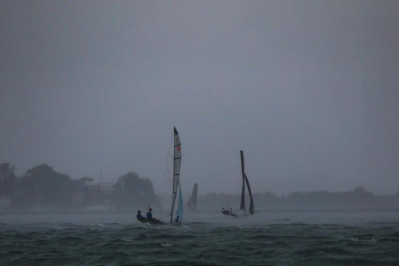 Squall at the start of Race 7 - 2023 Zhik Combined High Schools Sailing Championships photo copyright Red Hot Shotz - Chris Munro taken at Belmont 16ft Sailing Club and featuring the Cherub class
