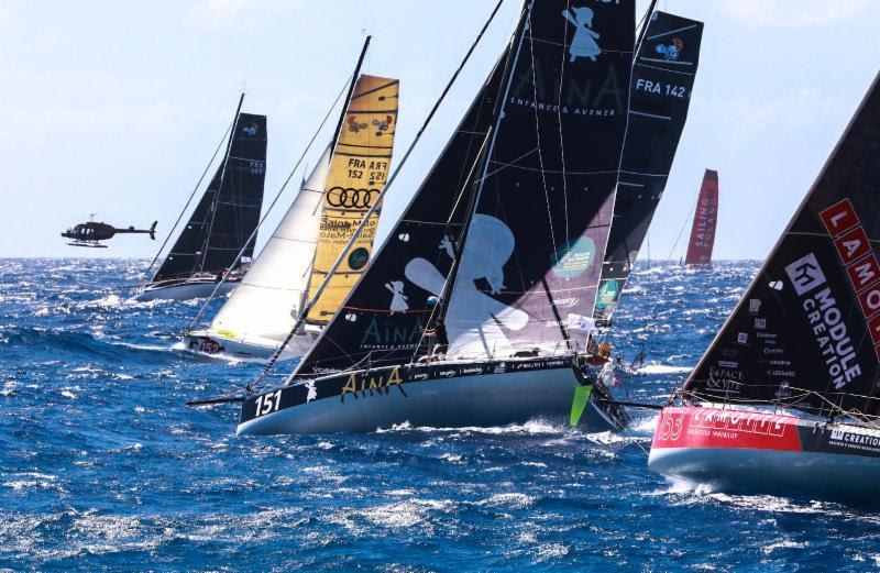 The ten-strong Class40 fleet with the media helicopter capturing their start - RORC Caribbean 600 - photo © RORC / Arthur Daniel