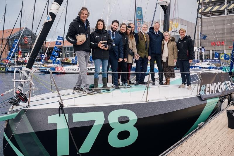Baptism of Class 40 # Empowher, skippers Pamela Lee and Jay Thompson, is photographed with Edouard Philippe, Mayor of Le Havre, skippers Brian Thompson and Karine Fauconnier, boss and deanery of sponsor DFDS, and other officials at the Transat Café L'or photo copyright Jean-Marie Liot / Alea taken at  and featuring the Class 40 class