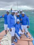 Thumbs up: Kate Middleton, Duchess of Cambridge, celebrates with the crew of Bahamian Sloop Ants Nest II. L-R: Keith Rolle, Joseph Brown Jr., Kate, Desmond Pinder, Samuel Rolle, Back: Joseph Brown Sr., Lee Armbrister, and James Wallace © Ants Nest II