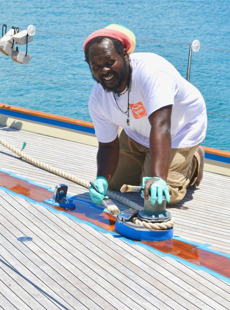 One of Antigua's artisan varnishers photo copyright ACYR taken at  and featuring the Classic Yachts class