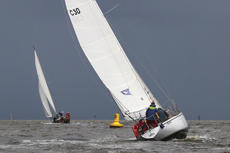Baranne skippered by Peter Jerabek heading into one of the many showers we had today.  They had a third in race one and second in race two, so maybe a first tomorrow? photo copyright A. J. McKinnon taken at Royal Yacht Club of Victoria and featuring the Classic Yachts class