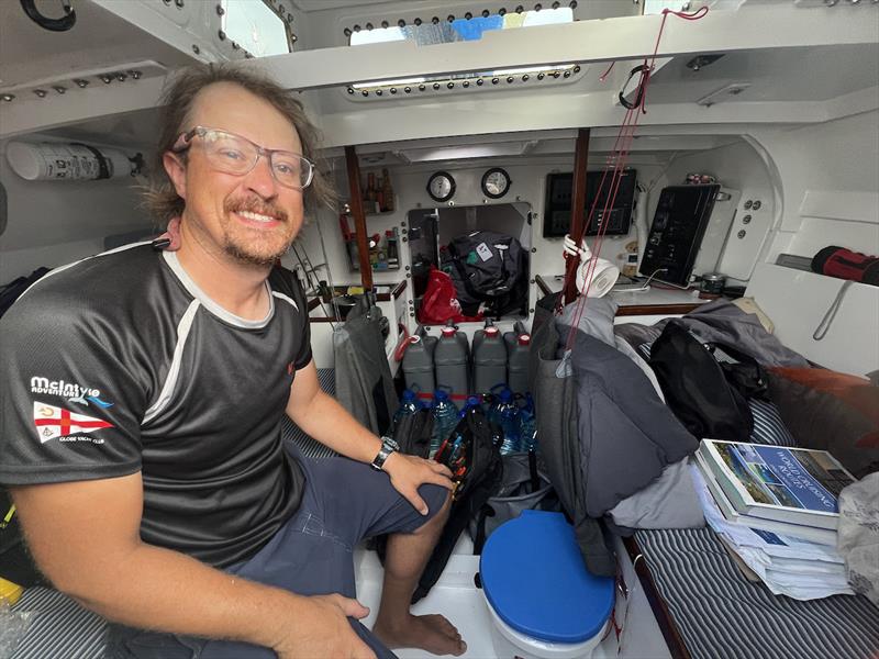 Josh Kali is the sweep boat at the back of the fleet, but enjoying the ride in his beautiful SKOOKUM loaded with water and 5 litre water bottles. Single use plastic is banned in the MGR, but 5 ltr Jugs are reusable - photo © Don McIntyre / MGR2025