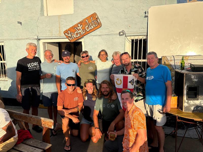 A special moment in St Helena — 11 #MGR2025 skippers present the race pennant to the Saint Helena Yacht Club photo copyright Adam Waugh / MGR2025 taken at St Helena Yacht Club and featuring the Class Mini 5.80 class