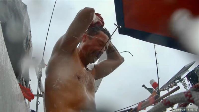 Doldrums, Squalls & Trade Winds: The Mini Globe Race fleet pushes for the Antigua finish—while Jakub doesn't miss a chance to grab a squall-powered bath - photo © Jakub Ziemkiewicz / MGR2025