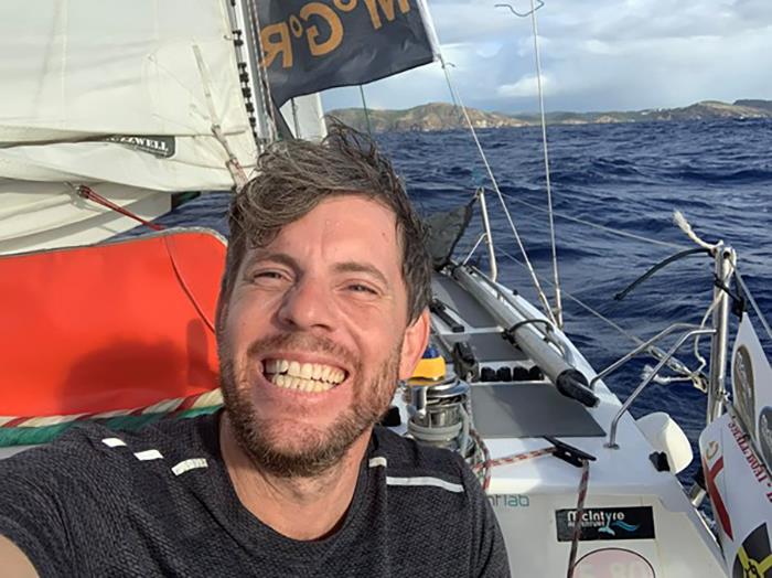 Dan Turner – Crossing the finish line after 28,000NM in Antigua aboard home-built, Immortal Game photo copyright Dan Turner taken at  and featuring the Class Mini 5.80 class