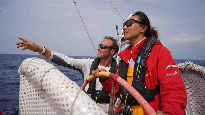 Zhang Shan at the helm of Qingdao being coached by Race Skipper Chris Brooks photo copyright Clipper Race taken at  and featuring the Clipper 70 class