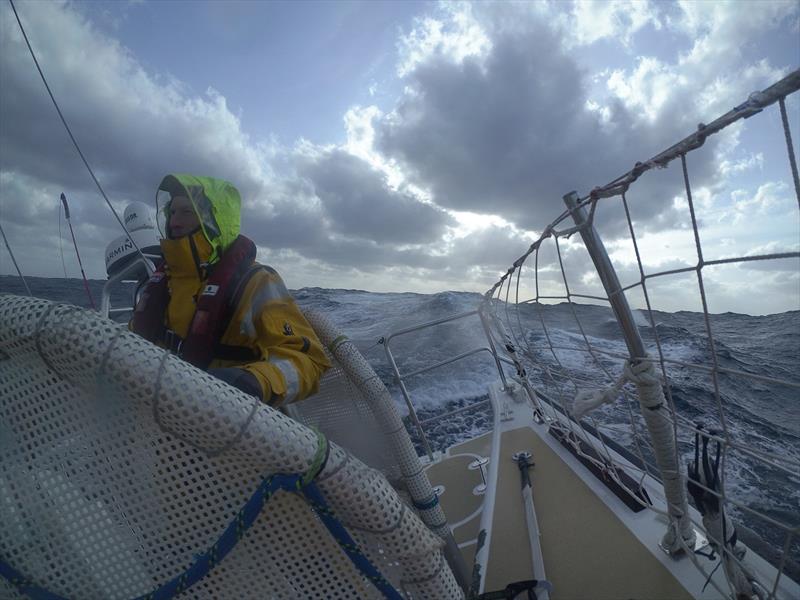 Craig at the helm of Nasdaq during his third North Pacific Ocean crossing! - photo © Clipper Race