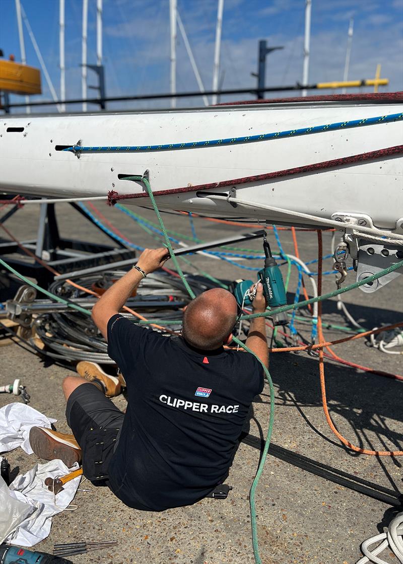 Rigger Andy Peck dissembles a Clipper 70 mast photo copyright Clipper Race taken at  and featuring the Clipper 70 class