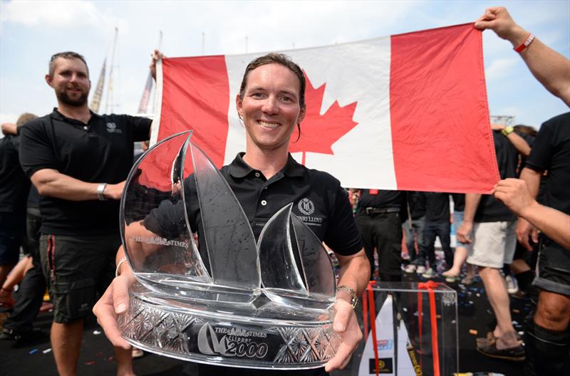 Henri Lloyd skipper Eric Holden celebrates with the Clipper Race trophy on the podium after the Round the World Race Finish in London. - photo © EMPICS Sport