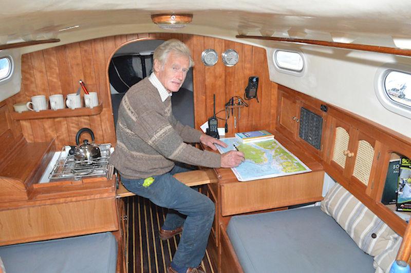Yachtsman, boatbuilder and 1977 Yachtsman of of the Year award winner Jeremy Rogers from Lymington, sitting at the chart table of his Contessa 26 production yacht Grayling photo copyright Barry Pickthall / PPL taken at  and featuring the Contessa 26 class
