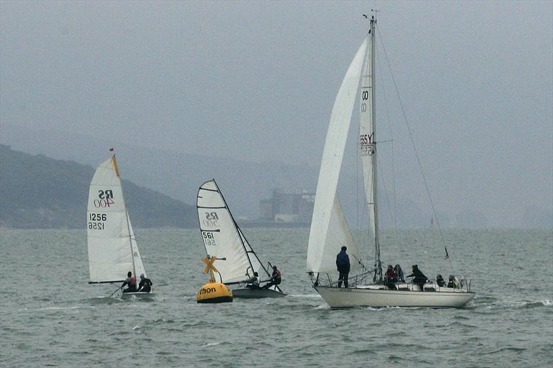 Contessa South Haze and dinghies rounding Berthon during Ineos Solent Circuit 2013 race 1 photo copyright Chris Leighton taken at Lymington Town Sailing Club and featuring the Contessa 32 class
